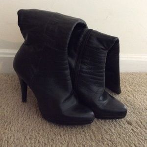Black leather calf-length boots